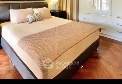 Luxurious bedroom with elegant decor and hardwood flooring