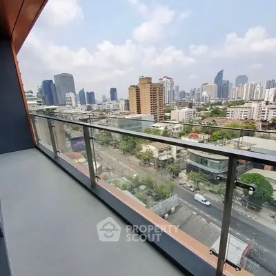 Spacious balcony with stunning city skyline view in modern apartment