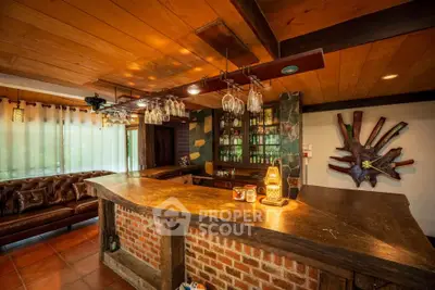 Rustic living room with brick bar and wooden ceiling, cozy ambiance.
