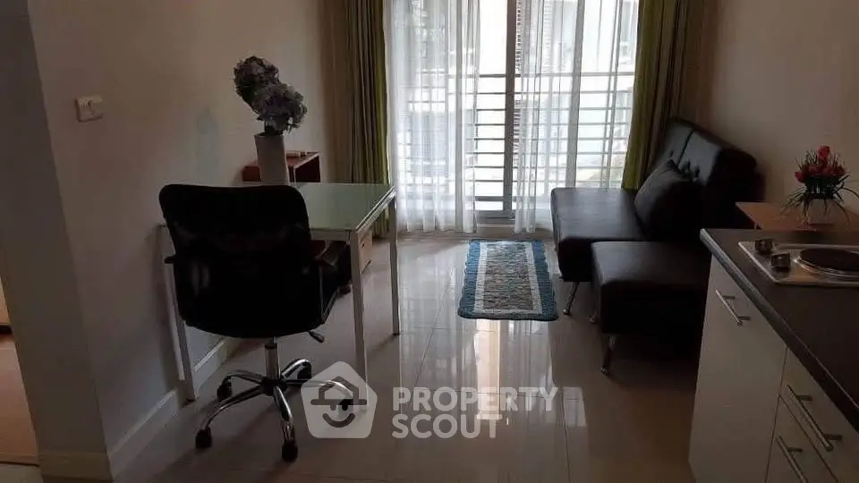 Modern living room with sleek furniture and natural light, ideal for urban living.