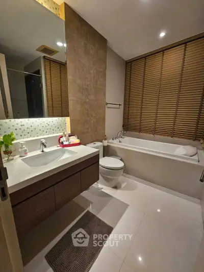 Modern bathroom with sleek fixtures and a luxurious bathtub, perfect for relaxation.