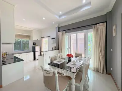 Elegant kitchen and dining area with modern decor and natural light