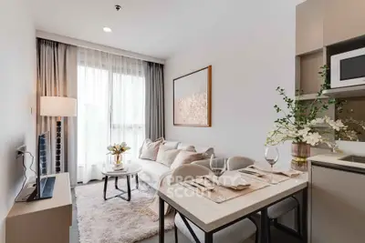 Modern living room with cozy dining area and elegant decor in a bright apartment.