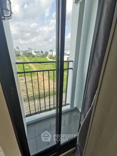 Charming balcony with scenic city and greenery views, perfect for relaxation and enjoying the outdoors.