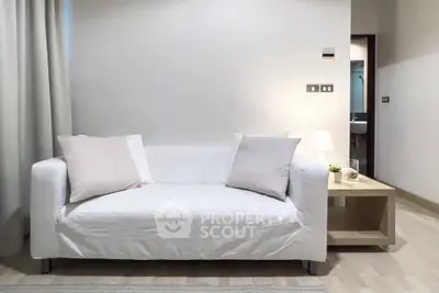 Cozy living room with white sofa and modern decor