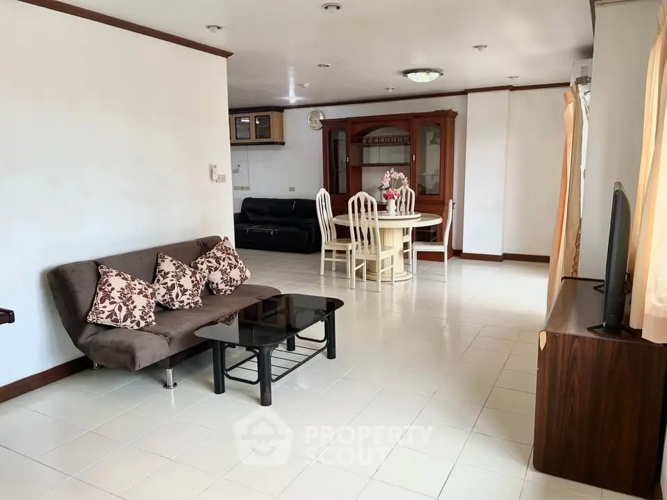 Spacious living room with modern furniture and dining area