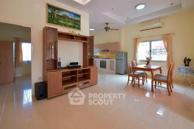 Spacious open-plan living area with modern kitchen and dining space
