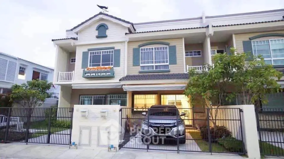 Charming townhouse with gated parking and lush greenery in a serene neighborhood.