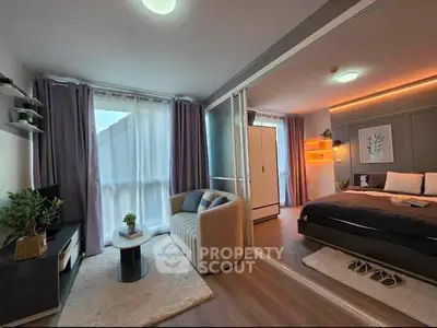 Modern studio apartment with cozy living area and stylish bedroom