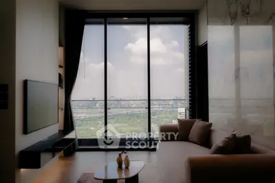 Luxurious living room with stunning city view from floor-to-ceiling windows.