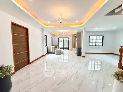Spacious modern living room with elegant lighting and glossy marble flooring