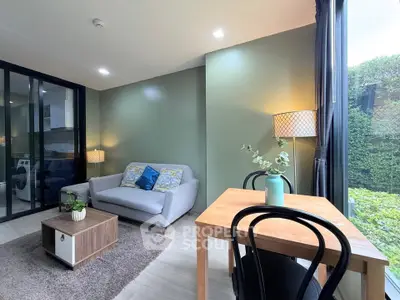 Modern living room with cozy seating and large window view