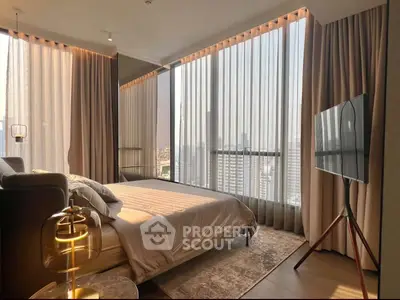 Luxurious bedroom with floor-to-ceiling windows offering stunning city views and elegant decor.