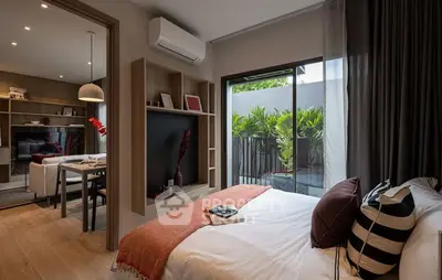 Modern bedroom with balcony access and stylish decor
