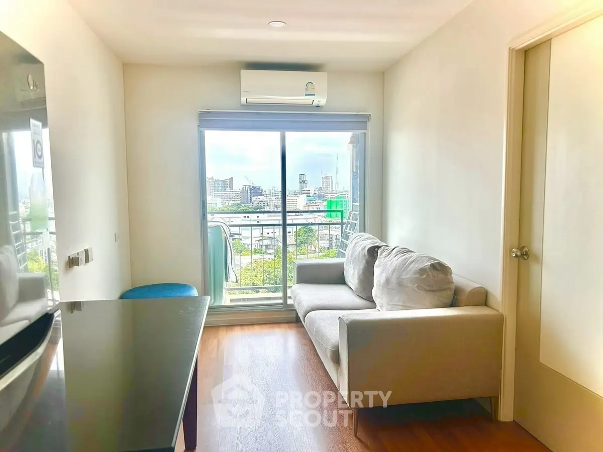 Modern living room with city view and cozy sofa, perfect for urban living.