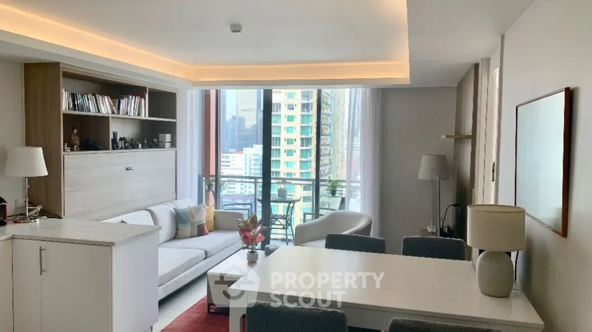 Modern living room with city view, stylish furniture, and ample natural light in a high-rise apartment.