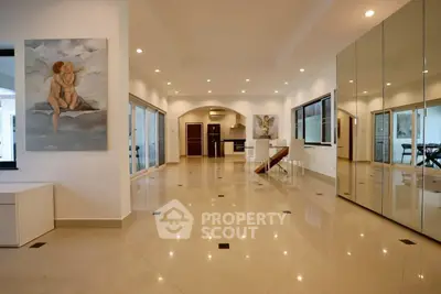 Spacious modern living room with open kitchen and elegant decor