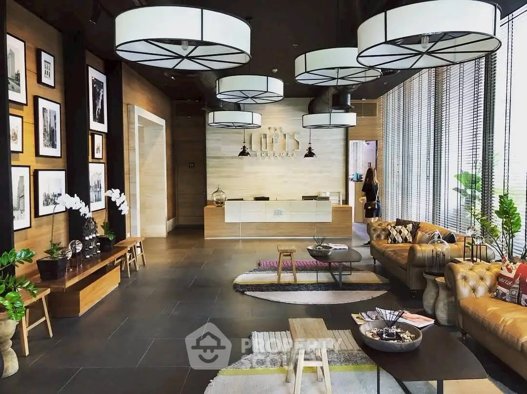 Luxurious modern lobby with stylish seating and elegant decor in a high-end building.