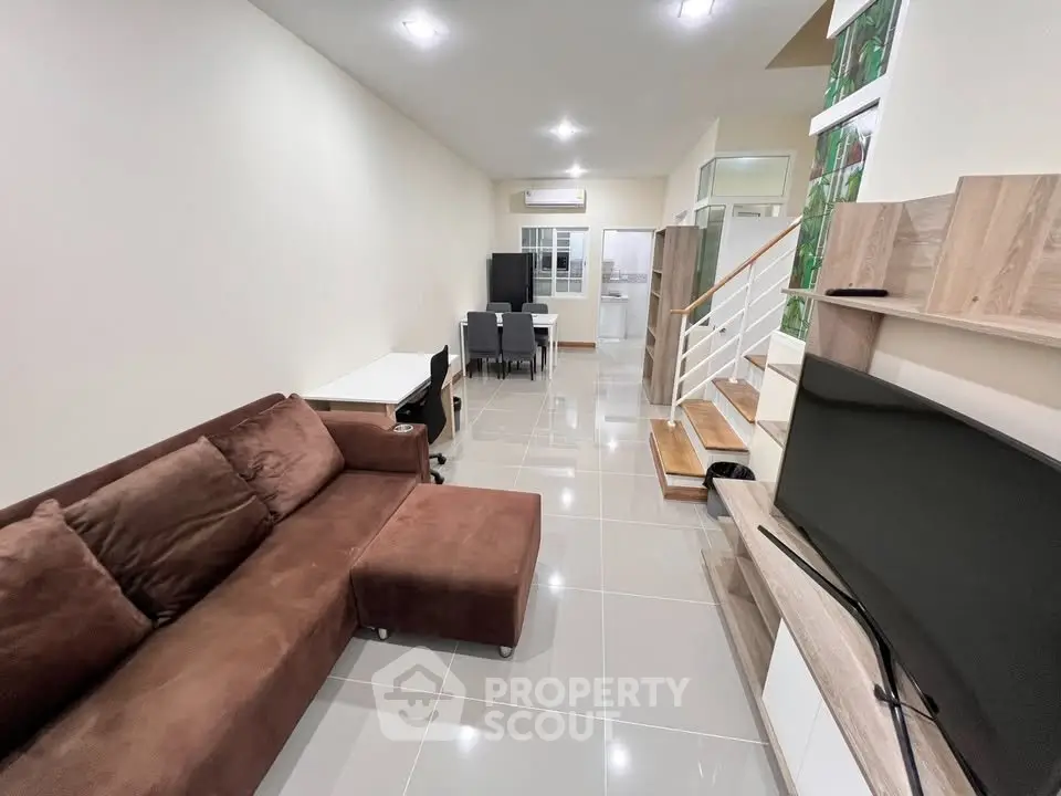 Spacious modern living room with sleek furniture and open layout