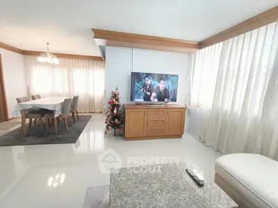 Spacious living room with elegant dining area and modern decor