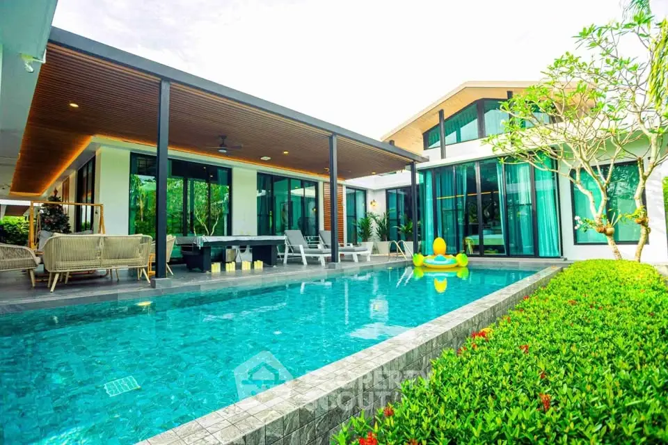 Luxurious modern villa with private pool and lush garden, perfect for relaxation and entertainment.