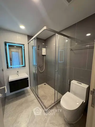 Modern bathroom with sleek shower enclosure and contemporary fixtures