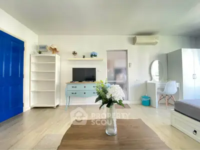 Bright and airy living room with modern decor and air conditioning