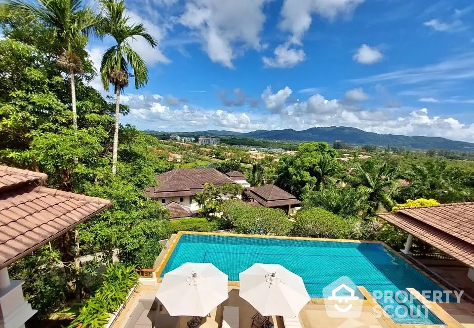 Stunning villa with pool and panoramic mountain views in tropical paradise setting.