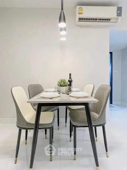 Modern dining area with elegant table and chairs, perfect for stylish home gatherings.
