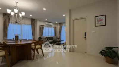 Elegant open living and dining area with modern decor and ample natural light.