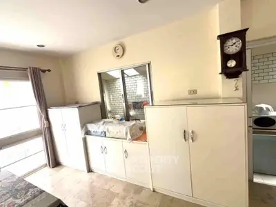Bright kitchen with ample storage and natural light