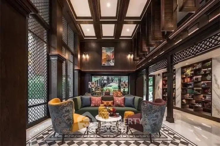 Luxurious living room with elegant decor and high ceilings in a modern home.
