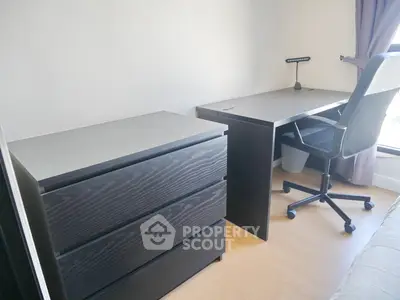 Modern study room with sleek desk and ergonomic chair, perfect for productivity.