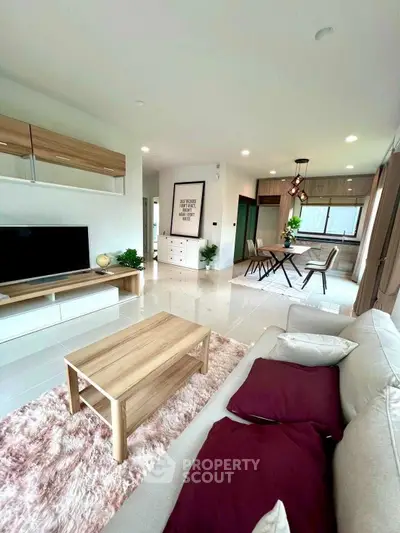 Spacious modern living room with stylish furniture and open layout