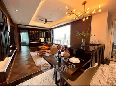 Luxurious open-layout living room with modern kitchen and stunning city view, featuring elegant lighting and stylish decor.