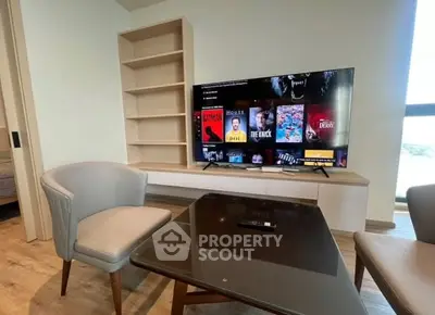 Modern living room with stylish furniture and large TV setup