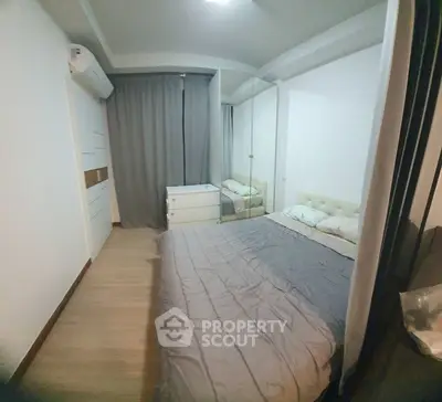 Cozy bedroom with mirrored wardrobe and air conditioning