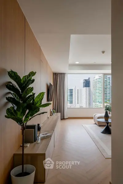 Luxurious modern living room with city view, elegant decor, and natural light.