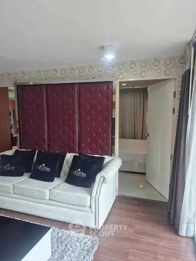 Luxurious living room with elegant sofa and stylish decor in modern apartment.
