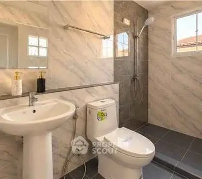 Modern bathroom with elegant marble tiles and sleek fixtures