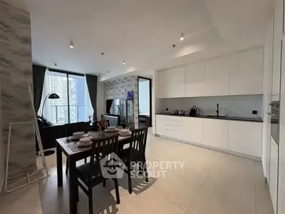 Modern open-layout kitchen and dining area with city view, sleek design and natural light.