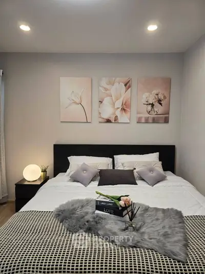 Cozy bedroom with elegant decor and soft lighting, perfect for relaxation.