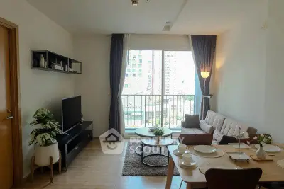Modern living room with large window and stylish decor in urban apartment