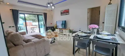 Stylish living room with modern decor and balcony access