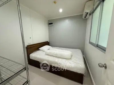 Cozy bedroom with modern air conditioning and minimalist design, perfect for restful nights.