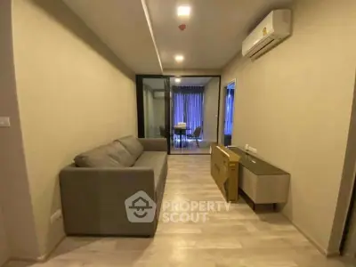 Modern living room with sleek design and air conditioning unit