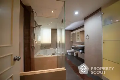 Luxurious modern bathroom with glass shower and elegant fixtures