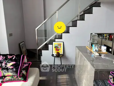 Modern living room with stylish staircase and contemporary decor