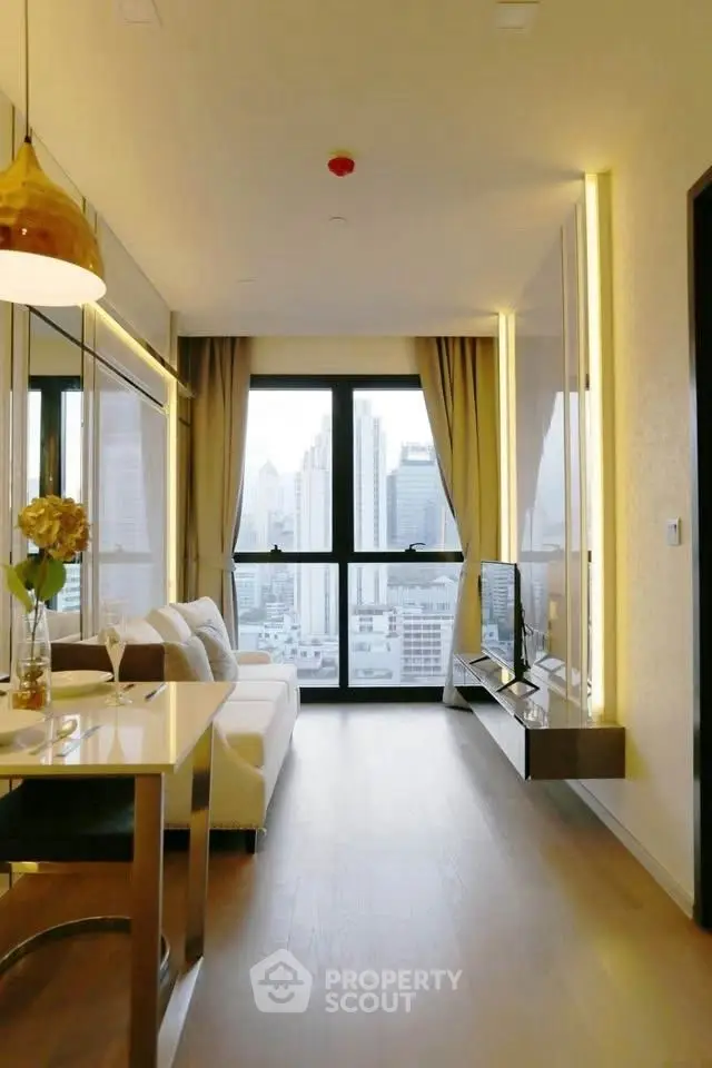 Modern living room with city view and stylish decor in high-rise apartment