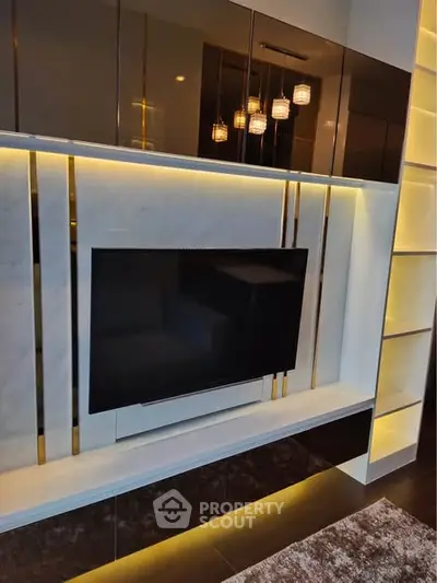 Modern living room with sleek TV unit and ambient lighting